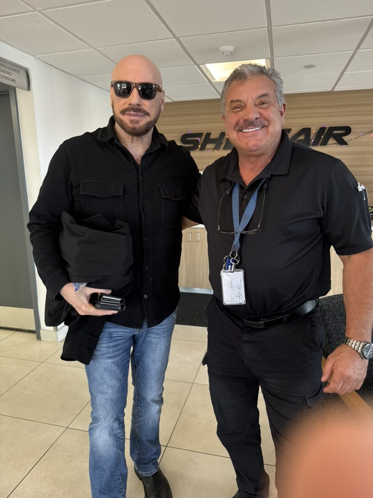 Captain Frank with an aviation colleague in a terminal
