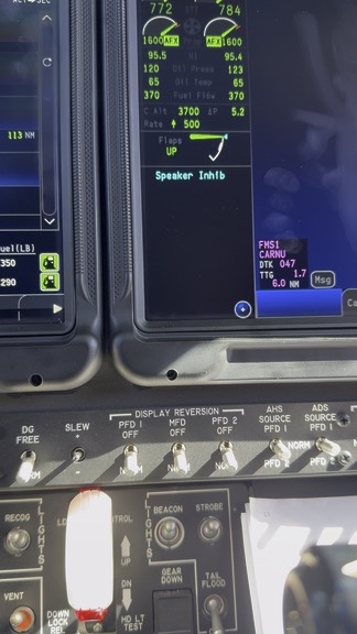 Cockpit display showing speaker inhibit annunciation